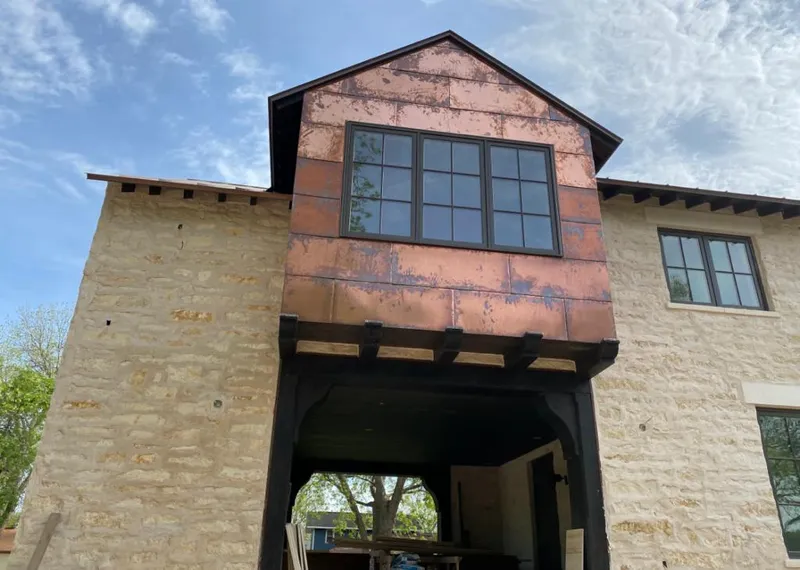 Copper metal panel facade on a stone building for Metal Roof Coating in Valley Stream
